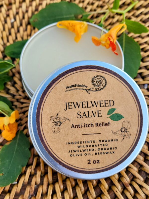 A jar of jewelweed salve sitting on top of a table.
