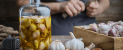 A person is peeling garlic on the table