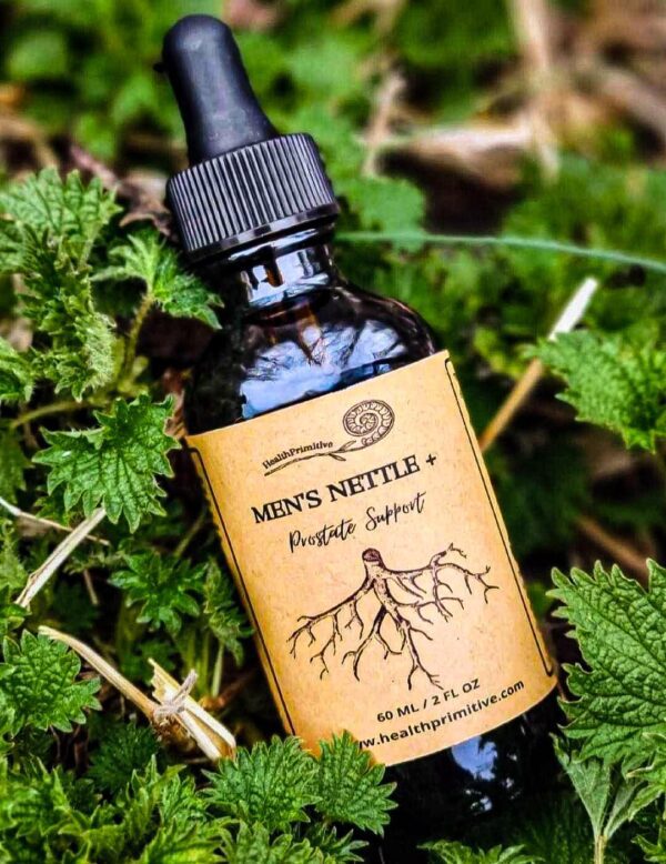 A bottle of men 's nettle tincture sitting in the grass.