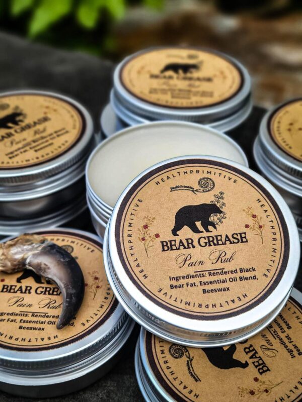 A group of bear grease products sitting on top of a table.