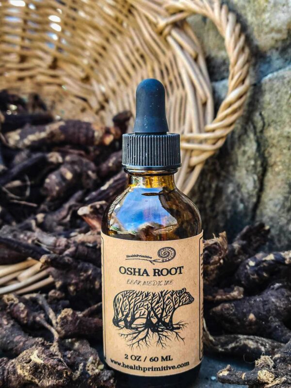 A bottle of oshea root is sitting in front of some baskets.