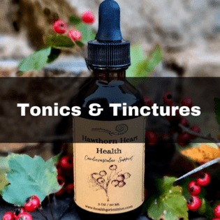 A bottle of tincture sitting on top of a table.