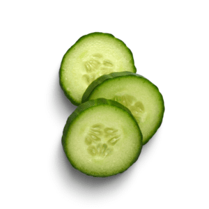 Three slices of cucumber are sitting on a white surface.